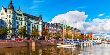 Scenic summer view of the Old Port pier architecture with ships, yachts and other boats in the Old Town of Helsinki, Finland