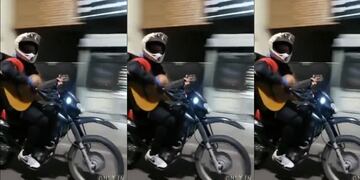 Filmó mientras manejaba a un motociclista tocando la guitarra en ruta.