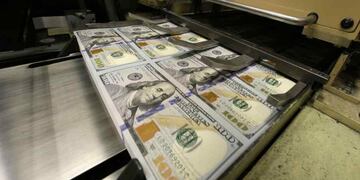 Baja el dólar Qatar (Archivo/AP).
