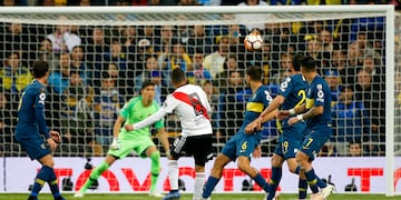 Juan Quintero of Argentina's River Plate, 8, scores his side's second goal against Argentina's Boca Juniors during extra time of the Copa Libertadores final soccer match at the Santiago Bernabeu stadium in Madrid, Spain, Sunday, Dec. 9, 2018. (AP Photo/Andrea Comas)