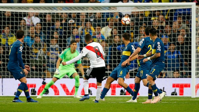 Juan Quintero of Argentina's River Plate, 8, scores his side's second goal against Argentina's Boca Juniors during extra time of the Copa Libertadores final soccer match at the Santiago Bernabeu stadium in Madrid, Spain, Sunday, Dec. 9, 2018. (AP Photo/Andrea Comas)