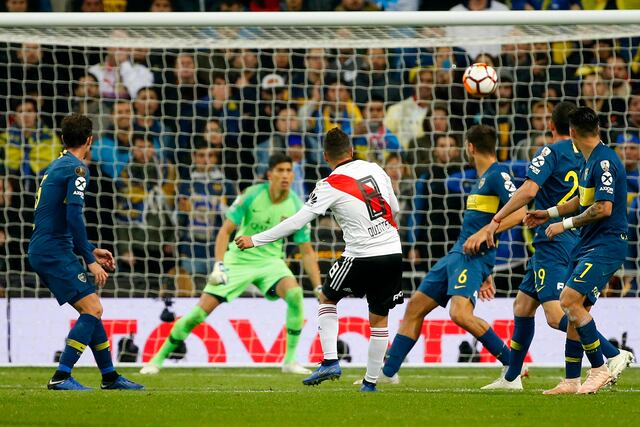Juan Quintero of Argentina's River Plate, 8, scores his side's second goal against Argentina's Boca Juniors during extra time of the Copa Libertadores final soccer match at the Santiago Bernabeu stadium in Madrid, Spain, Sunday, Dec. 9, 2018. (AP Photo/Andrea Comas)