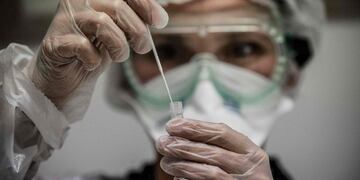 A medical assistant takes a sample from a patient for a coronavirus (Covid-19) test at an analysis laboratory in Le Peage-de-Roussillon, some 30kms south of Lyon, south-eastern France on September 22, 2020\u002E (Photo by JEFF PACHOUD / AFP)