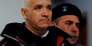 Former gardener Armando Gomez is escorted as he leaves a courtroom after the beginning of his trial over allegations of sexual abuse in Mendoza, Argentina, on August 5, 2019\u002E - Italian Catholic priest Nicola Corradi, Argentinian Catholic priest Horacio Corbacho and Gomez were accused of sexually abusing children at the Antonio Provolo Institute, dedicated to the education of deaf children in Mendoza\u002E (Photo by Andres Larrovere / AFP)