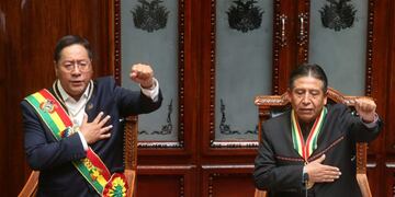 Bolivia's new President Luis Arce, left, and Vice President David Choquehuanca sing the national anthem on their inauguration day at Congress in La Paz, Bolivia, Sunday, Nov\u002E 8, 2020\u002E (AP Photo/Jorge Mamani)