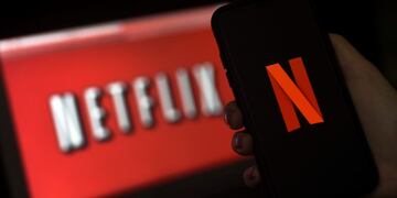 (FILES) In this file illustration photo taken on March 31, 2020 a computer screen and mobile phone display the Netflix logo in Arlington, Virginia\u002E - While coronavirus has brought Hollywood to a halt, Netflix has enjoyed record success\u002E But will the streaming giant's well-stocked slate of future shows be enough to maintain that growth? (Photo by Olivier DOULIERY / AFP)