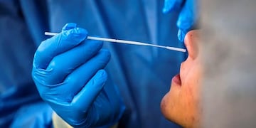 Rome (Italy), 10/11/2020\u002E- A Healthcare worker, wearing a protective suit, performs a Covid-19 swab test at the Roma Termini Binario95 social hub test center, during the Coronavirus Covid-19 pandemic emergency in Rome, Italy, 10 November 2020\u002E The social hub Binario95, located at the central Roma Termini station, provides coronavirus tests for homeless people, care workers and volunteers\u002E (Italia, Roma) EFE/EPA/ANGELO CARCONI ATTENTION: This Image is part of a PHOTO SET