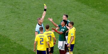 Soccer Football - World Cup - Group F - Mexico vs Sweden - Ekaterinburg Arena, Yekaterinburg, Russia - June 27, 2018   Mexico's Jesus Gallardo is shown a yellow card by referee Nestor Pitana    REUTERS/Damir Sagolj
