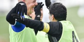 FIFA president Gianni Infantino (L) and Argentinian football legend Diego Armando Maradona celebrate after Maradona scored a penalty during a FIFA Football Legends football game ahead of The Best FIFA Football Awards 2016 on January 9, 2017 at the FIFA's
