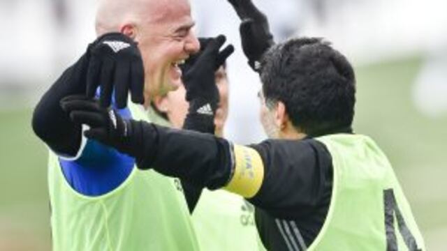 FIFA president Gianni Infantino (L) and Argentinian football legend Diego Armando Maradona celebrate after Maradona scored a penalty during a FIFA Football Legends football game ahead of The Best FIFA Football Awards 2016 on January 9, 2017 at the FIFA's