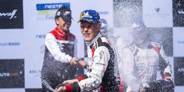 Winner Ott Tänak of Estonia sprays champagne after winning the Neste Rally in Jyväskylä, Central Finland, on August 4, 2019\u002E (Photo by Hannu Rainamo / Lehtikuva / AFP) / Finland OUT