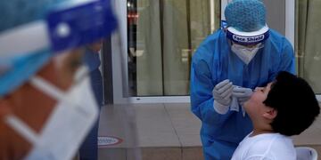 Medical officials conduct coronavirus tests, at Engomi B primary school in capital Nicosia, Cyprus, Thursday, May 21, 2020\u002E Cyprus took a major step toward a return to normality on Thursday when most restrictions of a two month-long stay-at-home order were lifted, allowing primary school kids to return to classes and hair salons and outdoor cafeterias to re-open\u002E (AP Photo/Petros Karadjias)