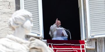 Pope Francis blesses the crowd from the window of the  apostolic palace overlooking St Peter's square during the Sunday Angelus prayer, on June 7, 2020, in the Vatican\u002E (Photo by Andreas SOLARO / AFP)