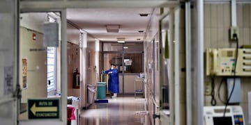 A nurse is seen after checking on a patient at the internal medicine area of the \