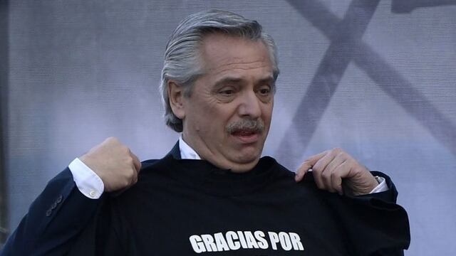 Argentina's presidential candidate for the Frente de Todos party, Alberto Fernandez, holds a jersey reading \