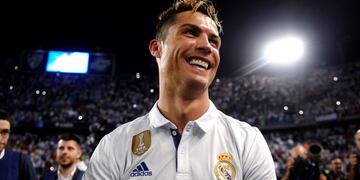 Real Madrid's Cristiano Ronaldo celebrates after winning a Spanish La Liga soccer match between Malaga and Real Madrid in Malaga, Spain, Sunday, May 21, 2017. Real Madrid wins the Spanish league for the first time in five years, avoiding its biggest title drought since the 1980s. (AP Photo/Daniel Tejedor)