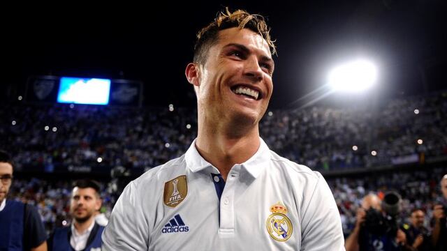 Real Madrid's Cristiano Ronaldo celebrates after winning a Spanish La Liga soccer match between Malaga and Real Madrid in Malaga, Spain, Sunday, May 21, 2017. Real Madrid wins the Spanish league for the first time in five years, avoiding its biggest title drought since the 1980s. (AP Photo/Daniel Tejedor)