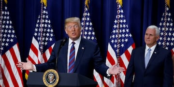 U\u002ES\u002E President Donald Trump speaks next to Vice President Mike Pence prior to signing the \