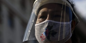 Members of Polo Obrero social organization protest at Plaza de Mayo square holding banners during a May Day demosntration in Buenos Aires, Argentina, on May 1, 2020\u002E - Argentina went to lockdown imposed by the government against the spread of the new coronavirus, COVID-19 since March 20\u002E (Photo by JUAN MABROMATA / AFP)