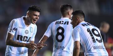 Argentina's Racing Club midfielder Brian Mansilla (R) celebrates with teammate forward Gustavo Bou (L) after scoring against Colombia's Rionegro Aguilas during their Copa Sudamericana football match at Juan Domingo Peron stadium in Buenos Aires, Argentina, on March 1, 2017\u002E / AFP PHOTO / JUAN MABROMATA cancha racing brian mansilla gustavo bou futbol copa sudamericana 2017 futbol futbolistas racing club rio negro aguilas
