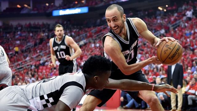 San Antonio Spurs guard Manu Ginobili, right, grabs a loose ball from Houston Rockets center Clint Capela during the first half in Game 6 of an NBA basketball second-round playoff series, Thursday, May 11, 2017, in Houston. (AP Photo/Eric Christian Smith)