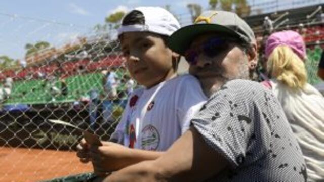 Argentina former footballer Diego Maradona poses with his grandson Benjamin Aguero (son of Gininna Maradona and footballer Sergio Aguero) after Italy's tennis player Paolo Lorenzi defeated by 6-3, 6-3, 6-3, Argentina's Guido Pella in their 2017 Davis Cup