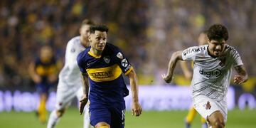 Soccer Football - Copa Libertadores - Round of 16 - Second Leg - Boca Juniors v Athletico Paranaense - Alberto J\u002E Armando, Buenos Aires, Argentina - July 31, 2019 Athletico Paranaense's Marcio Azevedo in action Boca Juniors' Mauro Zarate REUTERS/Agustin Marcarian