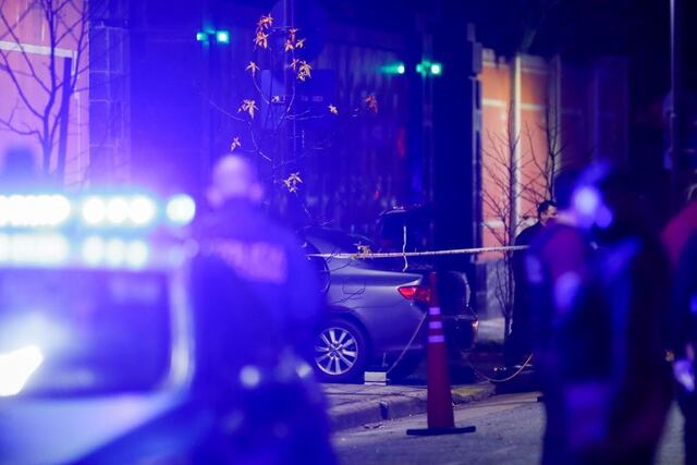 Police officers walk past a car which, according to local media, was crashed by a man into the exterior gate of the Chinese embassy in Buenos Aires, Argentina June 22, 2020\u002E REUTERS/Agustin Marcarian