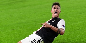 TOPSHOT - Juventus' Argentine forward Paulo Dybala celebrates after scoring his second goal during the UEFA Champions League Group D football match Juventus vs Lokomotiv Moscow on October 22, 2019 at the Juventus stadium in Turin\u002E (Photo by Miguel MEDINA / AFP)