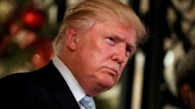 FILE - In this Wednesday, Dec. 28, 2016 file photo, President-elect Donald Trump listens to a question as he speaks to reporters at Mar-a-Lago, in Palm Beach, Fla. Trump says he owns a