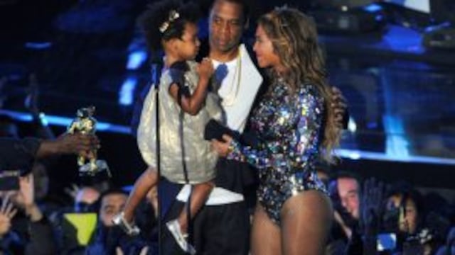FILE - This Aug 24, 2014 file photo shows Beyonce on stage with Jay Z and their daughter Blue Ivy as she accepts the Video Vanguard Award at the MTV Video Music Awards in Inglewood, Calif. Beyonce announced on her Instagram account, Wednesday, Feb. 1, 201