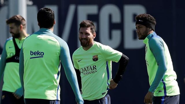 FC Barcelona's Neymar, right, Lionel Messi, center, and Luis Suarez, back, attend a training session at the Sports Center FC Barcelona Joan Gamper in Sant Joan Despi, Spain, Tuesday, April 4, 2017. FC Barcelona will play against Sevilla during a Spanish L