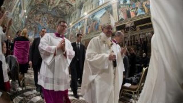 This handout picture released by the Vatican press office shows Pope Francis celebrating baptisms on January 8, 2017 at the Sistine Chapel in Vatican. Pope Francis encouraged women to feel free to breastfeed their children in the church.