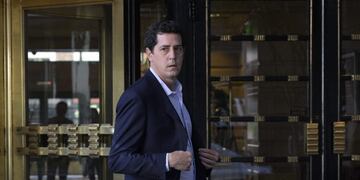 Argentina's Interior Minister Eduardo De Pedro leaves the Intercontinental hotel in Buenos Aires on March 16, 2020, before going to Ezeiza International airport from where a couple of US tourists will be expelled from the country for violating coronavirus quarantine rules\u002E - The couple defied restrictions imposed on visitors to try to limit the COVID-19 coronavirus pandemic\u002E (Photo by Juan MABROMATA / AFP)