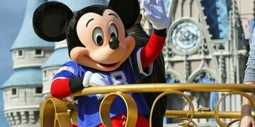 FILE - In this Feb\u002E 4, 2019, file photo, Mickey Mouse celebrates the Super Bowl winning team, the New England Patriots, during the Super Bowl victory parade in the Magic Kingdom at Walt Disney World in Lake Buena Vista, Fla\u002E Months after workers who play Mickey Mouse and Goofy at Walt Disney World threatened to leave the Teamsters union because of what they called \