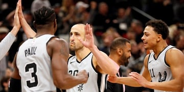 Dec 16, 2017; San Antonio, TX, USA; San Antonio Spurs shooting guard Manu Ginobili (20) celebrates with teammate while leaving the court after scoring the game winning basket against the Dallas Mavericks at AT&T Center\u002E Mandatory Credit: Soobum Im-USA TODAY Sports