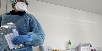 Biologists of the Synlab laboratory work at a COVID-19 coronavirus testing centre after collecting swab samples from employees of a company, in Lens, northern France, on May 18, 2020\u002E (Photo by DENIS CHARLET / AFP)
