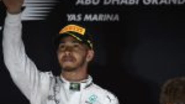 Mercedes AMG Petronas F1 Team's British driver Lewis Hamilton celebrates after winning the Abu Dhabi Formula One Grand Prix at the Yas Marina circuit on November 27, 2016.nNico Rosberg won his maiden Formula One world title by securing second place behind his Mercedes arch-rival Lewis Hamilton in the Abu Dhabi Grand Prix. / AFP PHOTO / MOHAMMED AL-SHAIKH