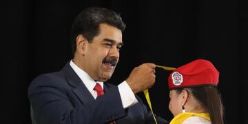 This handout photo released by Miraflores Presidential palace press office shows Venezuela's President Nicolas Maduro during the 8th Graduation of Integral Community doctors in Caracas, Venezuela on May 9, 2019\u002E - Venezuela's opposition leader Juan Guaido accused President Nicolas Maduro's govermment on Thursday of \