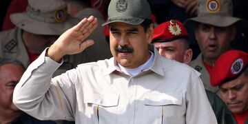 Venezuelan President Nicolas Maduro salutes the crowd during a military parade to commemorate the 17th anniversary of a failed 2002 coup d'état against late leader Hugo Chavez, at Fuerte Tiuna Military Complex, in Caracas on April 13, 2019\u002E (Photo by Yuri CORTEZ / AFP)