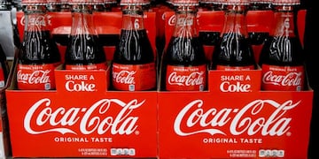 FILE--In this Aug\u002E 8, 2018, file photo, bottles of Coca Cola sit on a shelf in a market in Pittsburgh\u002E The Coca-Cola Company says that it's \