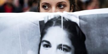 asesinato homicidio crimen y violacion de Micaela Garcia desapareciu00f3 en Gualeguay y fue encontrada asesinada estrangulada y violada violacion por el hombre acusado sebastian Wagner rnrnA demonstrator holds a sign displaying the image of murdered feminist activist Micaela Garcia during a Ni Una Menos (Not One Less) rally in protest of gender based violence in Buenos Aires, Argentina, on Tuesday, April 11, 2017. Ni Una Menos (Not One Less) was launched by a group of journalists, artists, and activists demanding that women be protected from violent deaths at the hands of men in Argentina. Photographer: Pablo E. Piovano ciudad de buenos aires micaela garcia marcha de ni una menos por la chica asesinada en Gualeguay marcha manifestacion pidiendo justicia por la joven asesinada joven desaparecida aparecio muerta asesinada