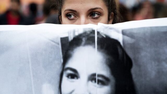 asesinato homicidio crimen y violacion de Micaela Garcia desapareciu00f3 en Gualeguay y fue encontrada asesinada estrangulada y violada violacion por el hombre acusado sebastian Wagner rnrnA demonstrator holds a sign displaying the image of murdered feminist activist Micaela Garcia during a Ni Una Menos (Not One Less) rally in protest of gender based violence in Buenos Aires, Argentina, on Tuesday, April 11, 2017. Ni Una Menos (Not One Less) was launched by a group of journalists, artists, and activists demanding that women be protected from violent deaths at the hands of men in Argentina. Photographer: Pablo E. Piovano ciudad de buenos aires micaela garcia marcha de ni una menos por la chica asesinada en Gualeguay marcha manifestacion pidiendo justicia por la joven asesinada joven desaparecida aparecio muerta asesinada