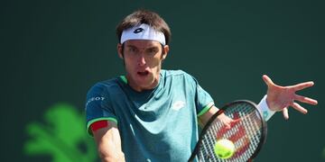 KEY BISCAYNE, FL - MARCH 22: Leonardo Mayer of Argentina plays a backhand against Donald Young of the United States in their first round match during the Miami Open Presented by Itau at Crandon Park Tennis Center on March 22, 2018 in Key Biscayne, Florida\u002E Clive Brunskill/Getty Images/AFP\n== FOR NEWSPAPERS, INTERNET, TELCOS & TELEVISION USE ONLY ==