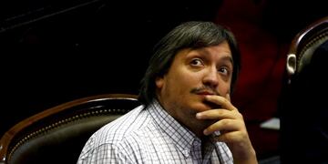 Maximo Kirchner (C), lawmaker of the opposition Victory Front and son of former Argentine President Cristina Fernandez de Kirchner, looks up as lawmakers debate the approval of a settlement with creditors over the country's defaulted debt at the Lower Hou