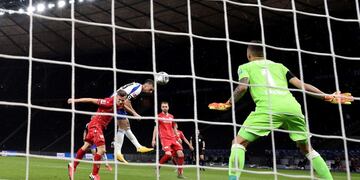 Hertha' s Vedad Ibisevic, second left, scores the opening goal during the German Bundesliga soccer match between Hertha BSC Berlin and 1\u002E FC Union Berlin in Berlin, Germany, Friday, May 22, 2020\u002E The German Bundesliga is the world's first major soccer league to resume after a two-month suspension because of the coronavirus pandemic\u002E (Stuart Franklin/Pool Photo via AP)