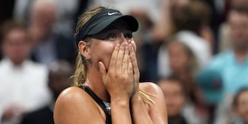 TOPSHOT - Maria Sharapova of Russia celebrates her victory over Simona Halep of Romania during their Women's Singles match at the 2017 US Open Tennis Tournament August 28, 2017 in New York\u002E \nSharapova marked her first Grand Slam appearance since her doping ban ended with a 6-4, 4-6, 6-3 victory over second seed Halep\u002E / AFP PHOTO / DON EMMERT