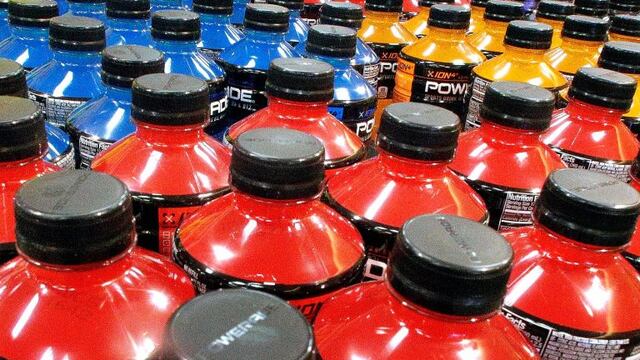 FILE - In this May 18, 2016 file photo, sodas and energy drinks are stacked and line the shelves in a grocery store in Springfield, Illinois. The World Health Organization, in a statement timed for World Obesity Day on Tuesday, Oct. 11, 2016, has recommen