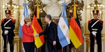 German Chancellor Angela Merkel, left, shakes hands with Argentina's President Mauricio Macri at the government house in Buenos Aires, Argentina, Thursday, June 8, 2017\u002E Merkel is on a official visit to Argentina\u002E(AP Photo/Natacha Pisarenko)