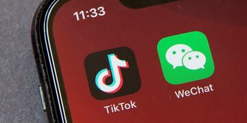 FILE - Icons for the smartphone apps TikTok and WeChat are seen on a smartphone screen in Beijing, in a Friday, Aug\u002E 7, 2020 file photo\u002E The Commerce Department said President Trump’s proposed ban of the apps WeChat and TikTok will go into effect Sunday, Sept\u002E 20, to “safeguard the national security of the United States\u002E” The government said its order, previously announced by Trump in August, will “combat China’s malicious collection of American citizens’ personal data\u002E” (AP Photo/Mark Schiefelbein, File)